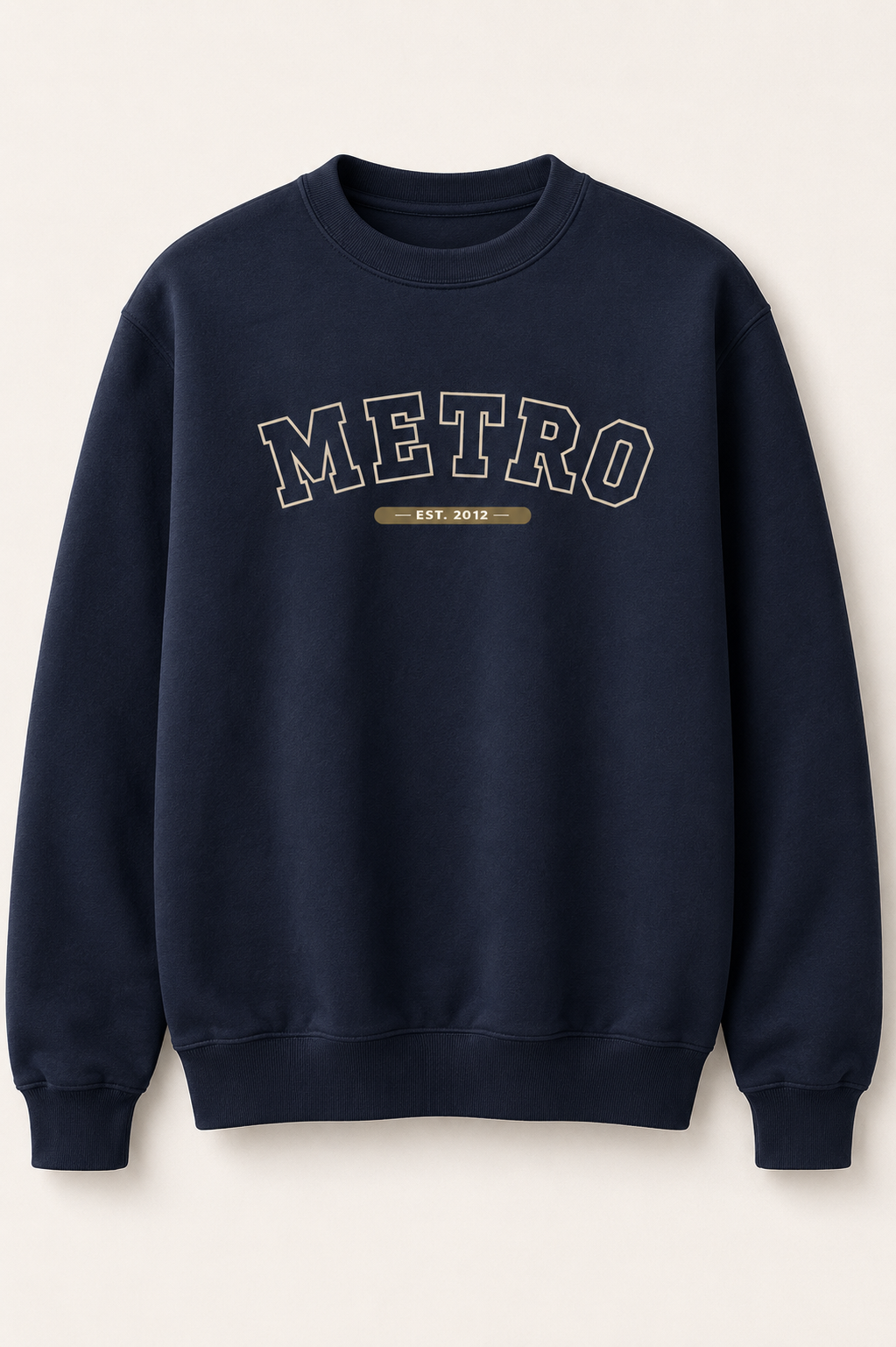 A navy blue crewneck sweatshirt with 'METRO EST. 2012' printed in arched varsity-style lettering on the chest, displayed against a light cream background.